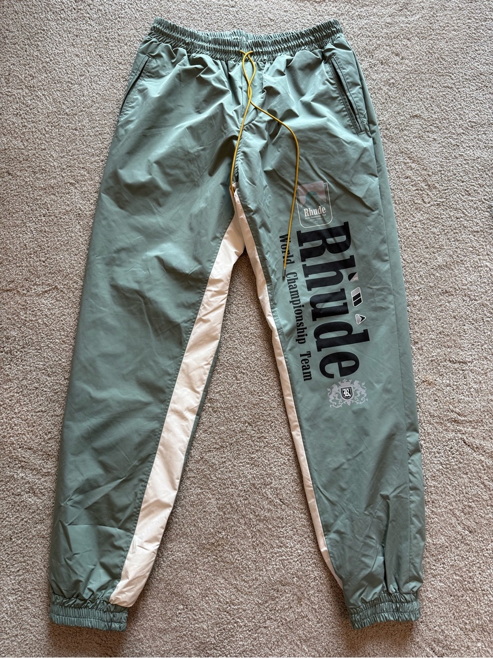 Rhude Sage Green and White Logo Track Pants with Yellow Drawcords
